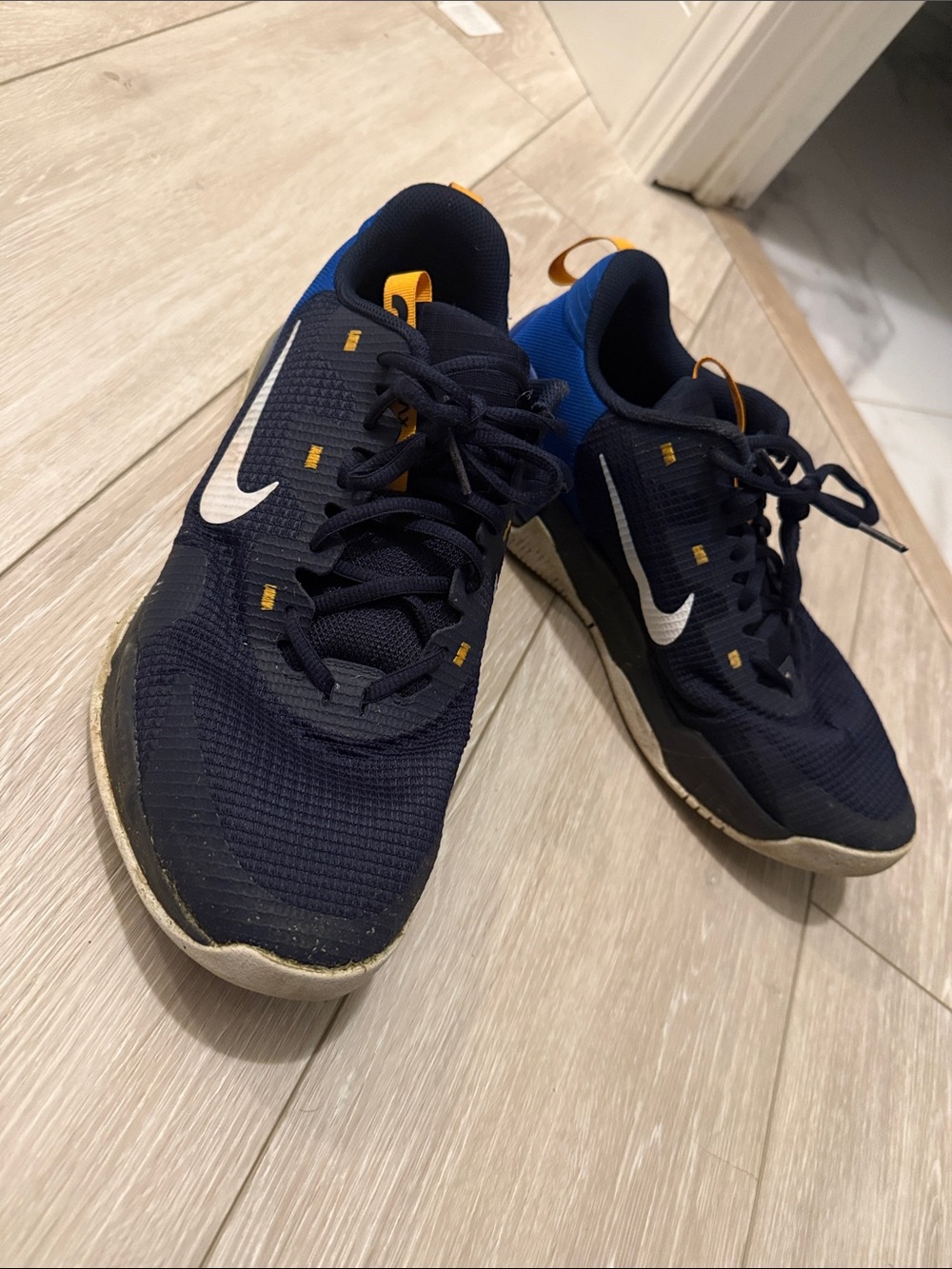 Nike Dark Blue and White Athletic Sneakers with Yellow Accents